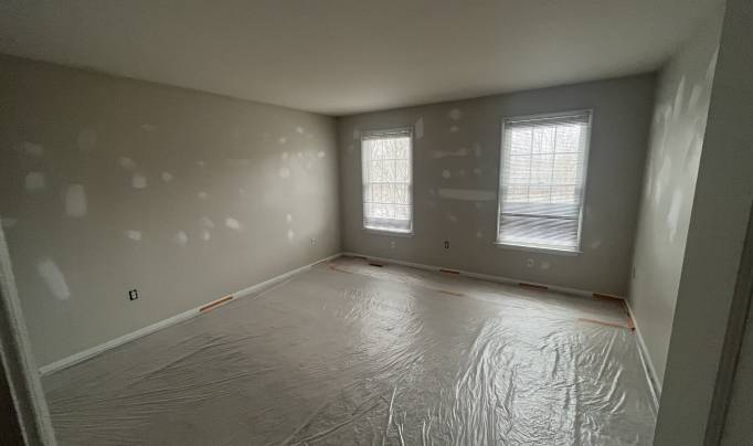 Image of a room with wallpapers being removed